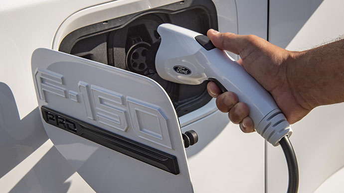 Ford F-150 electric truck charging port with charger