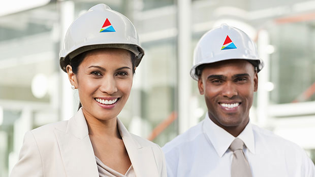 Employees in hardhats with logo