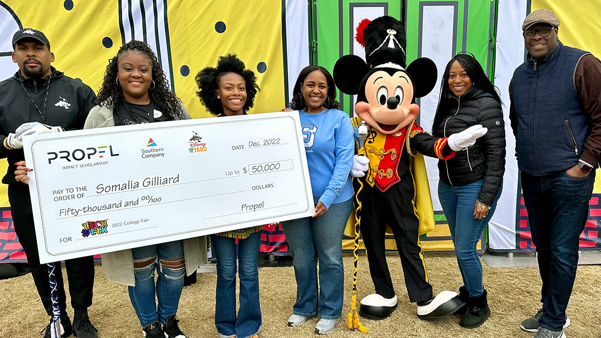 HBCU scholarship recipient with Mickey Mouse