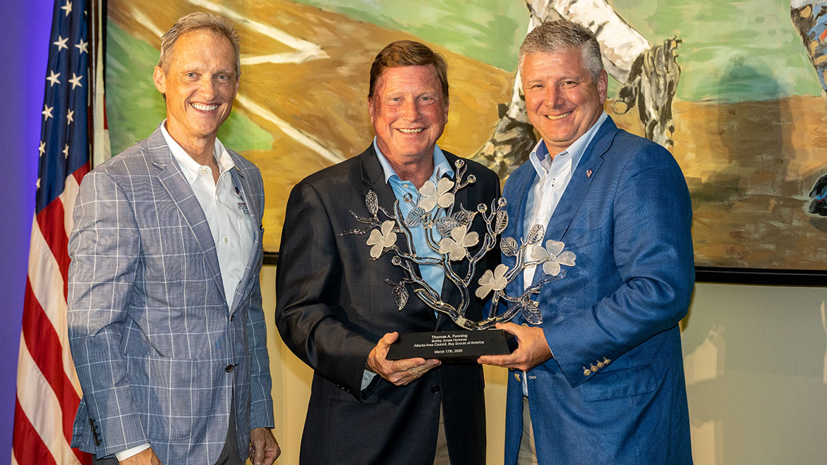 CEO Tom Fanning is shown with CEO of Atlanta Area Council, Scouting Tracy Techau (left) and Craig Gunkel (right), CEO of Iconex and chairman/MC of the 2021 Peach of an Athlete Role Model Banquet.
