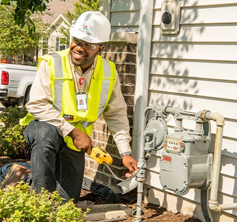 Black woman presenting to a group of men