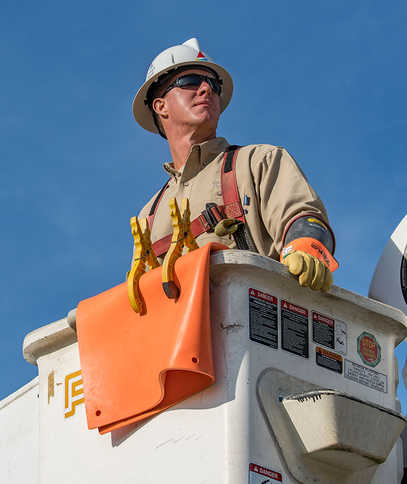 Line worker in bucket truck