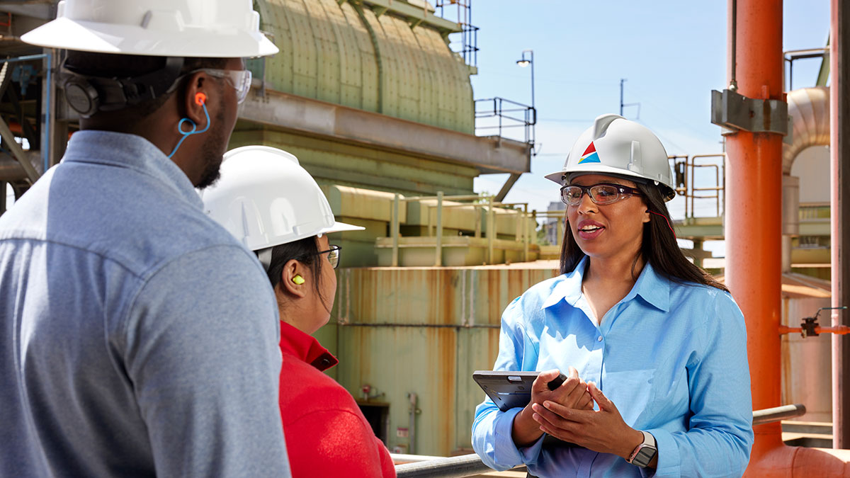 Plant workers discussing