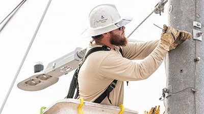 Mississippi Power lineman repairing lines
