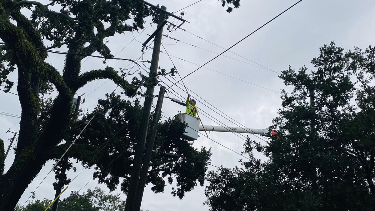 Mississippi Power lineman restoring damaged power line after Hurricane Ida