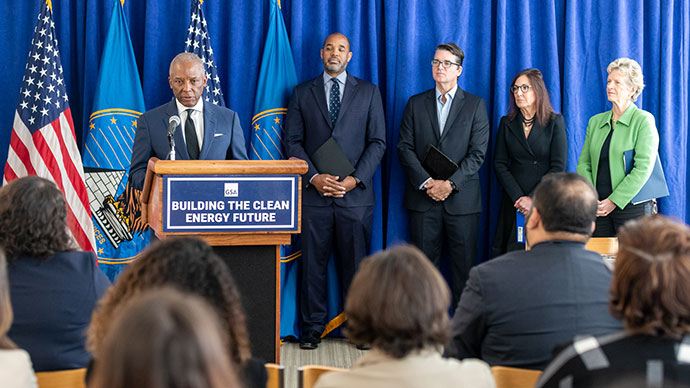 Chris Womack and other energy leaders speaking at MOU signing