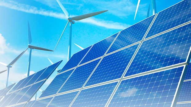 Solar panels and wind turbines before blue sky